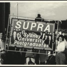 Students Holding SUPRA Banner