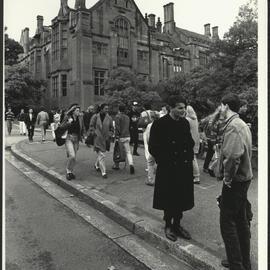 Students Walking on Manning Road Two Students in Conversation at Front Right, Anderson Stuart Building in Background