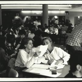 Students Discussing Uni Work in Cafeteria 