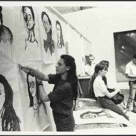 Students Hanging Artworks