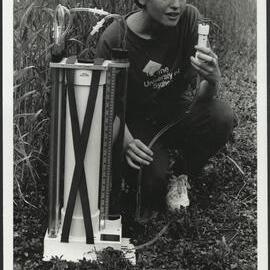 Agriculture Student in Wheat Field with Scientific Apparatus