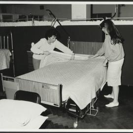 Faculty of Nursing - Practicing Nursing Skills Two Students Making a Bed
