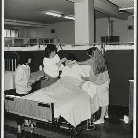 Faculty of Nursing - Putting Theory into Practice Three Nursing Students in a Laboratory