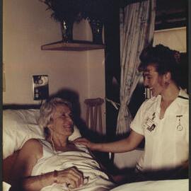 Faculty of Nursing - Putting Theory into Practice Nursing Student on the Ward at the Bed of a Hospital Patient