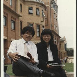 Vietnamese Masters Students Do Van Dung (L) and Nguyen Thi Tu Trang Outside the Education Building