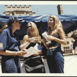 University Volunteer with Prospective Students at an Information Boot on Information Day 1999