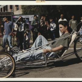 Engineering - Elliptical-Powered Pedal Car - Student Demonstrating the Use of the Car to Onlookers