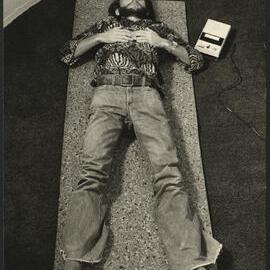 Relaxation Exercise with Student Lying Outstretched on Yoga Mat