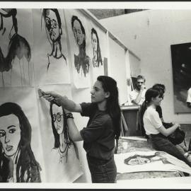 Sydney College of the Arts (SCA) Students in Studio Relaxing While One Student Takes Down Portrait Paintings