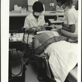 Dental Students Working on Patient