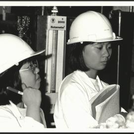 Two Women Chemical Engineering Students in a Workplace