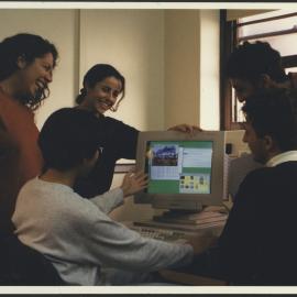 Five Engineering Students Around the Screen of a Computer