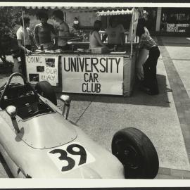 University Car Club Stand at O Week with a Race Car on Display