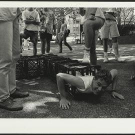 A Student Emerges from a Milk Crate Tunnel During Orientation Week 1992