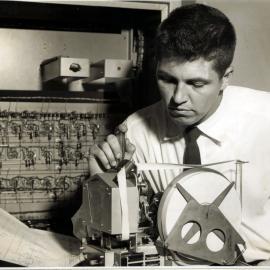 Brian De Ferranti with SILLIAC Punch Tape Reader