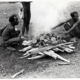 Men Sitting Around a Fire