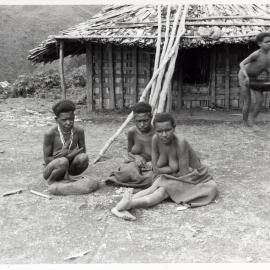 Group Sitting in Front of Building