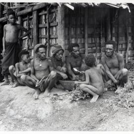 Group Sitting in Front of Building