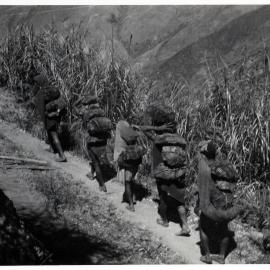 Group with Net Bags on Mountainside