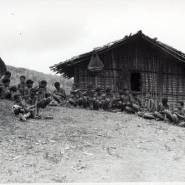 Group Sitting in Front of Building
