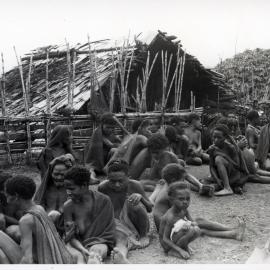 Group Sitting in Front of Building