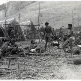 Group Preparing Pigs for Ceremony