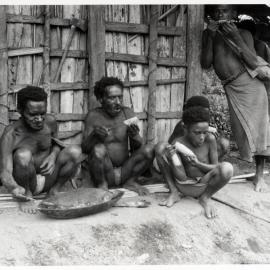Men and Children Eating