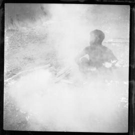 Man Sitting Beside Fire