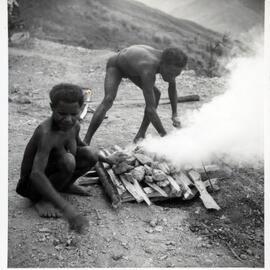 Men Preparing a Fire