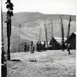 Group Standing in Mountainside Hamlet