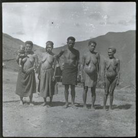 One Man and Four Women, With One Carrying a Baby