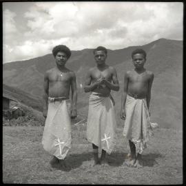 Three Men With Crosses Sewn on Clothing
