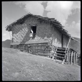 Building With Woven Walls and Raised Porch