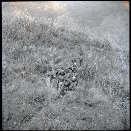 Group Walking Along Hill Path