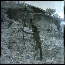 Man Posing with Bow