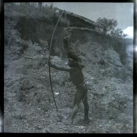 Man Posing with Bow