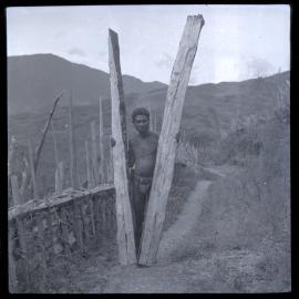 Man Holding Two Large Pieces of Wood
