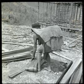 Woman Standing in Front of Partially-Constructed Building