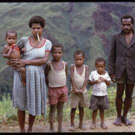 Man, Women and Four Children Standing on Mountainside