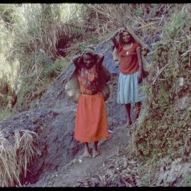 Women with Net Bags on Mountain Path