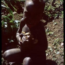Child Carrying Sweet Potatoes