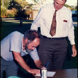 Signing Roger Carolin's Card at his Farewell