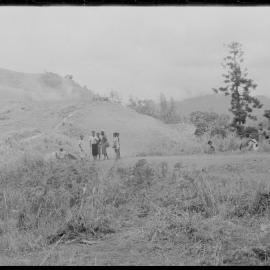Groups of People Gathered Across Mountain