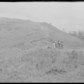 Groups of People Gathered Across Mountain