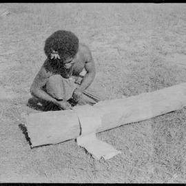 Man Processing Tree Bark