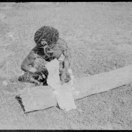 Man Processing Tree Bark
