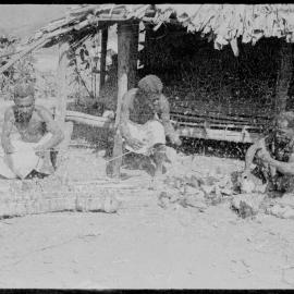 Men Preparing Pandanus Nut