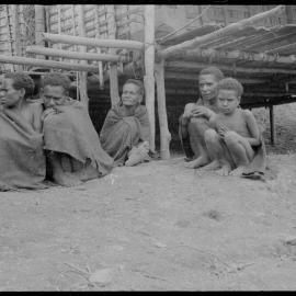 Group Sitting Outside a Building