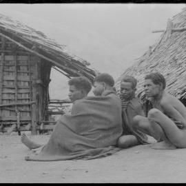 Group Sitting Outside a Building