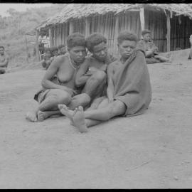 Group Sitting Outside a Building